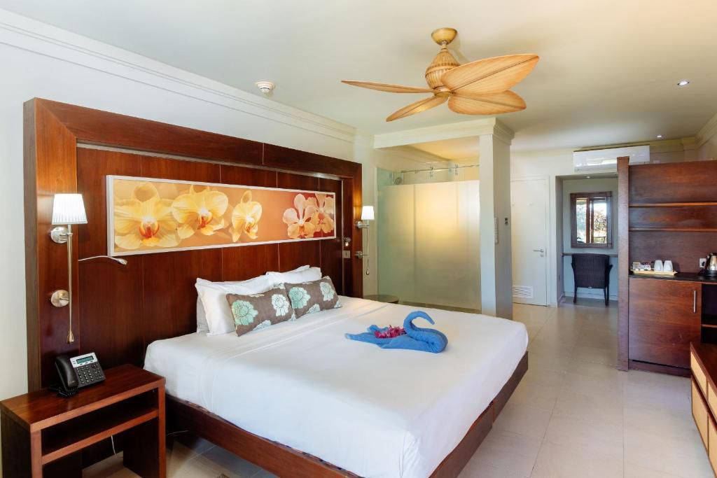 Ocean-view resort suite with king bed and private terrace